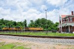 UP 6938 leads an eastbound intermodal by the former T&P Depot